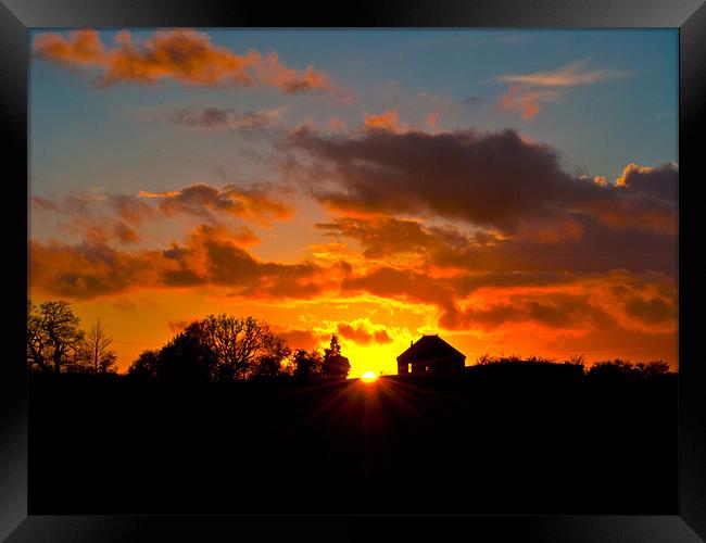 Sunset silhouette Framed Print by Kevin White