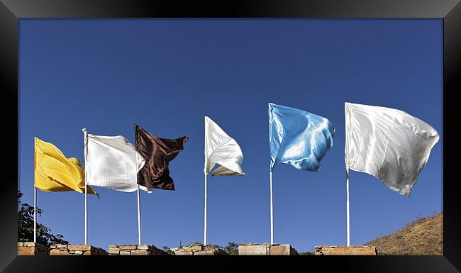 Flags fluttering against blue Sky Framed Print by Arfabita  