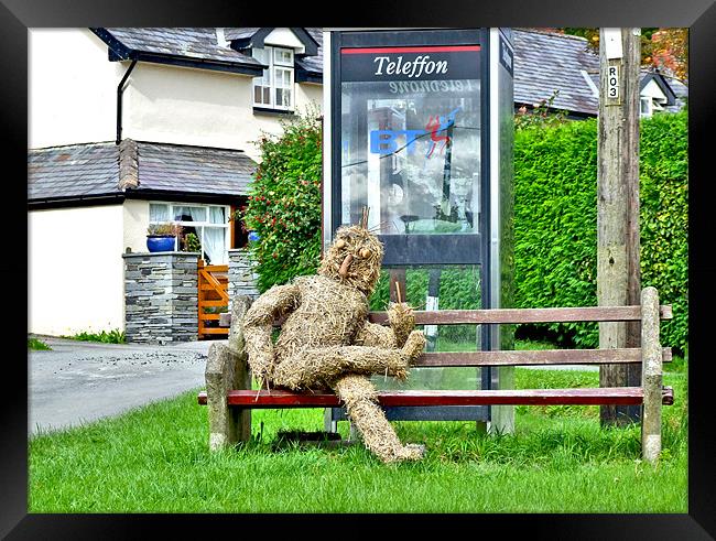 Strawman at Llanwrin Village Framed Print by philip clarke