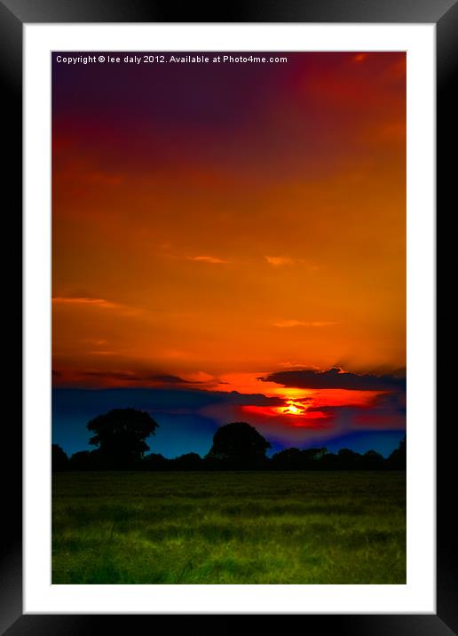 Sun set over Ludham. Framed Mounted Print by Lee Daly
