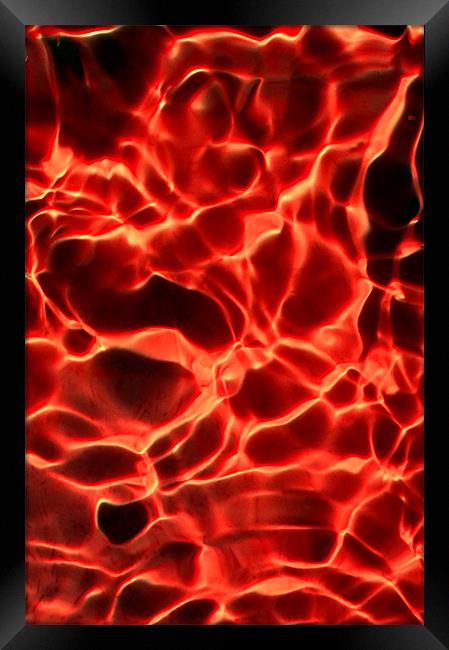 Red ripples in water Framed Print by Christopher Mullard