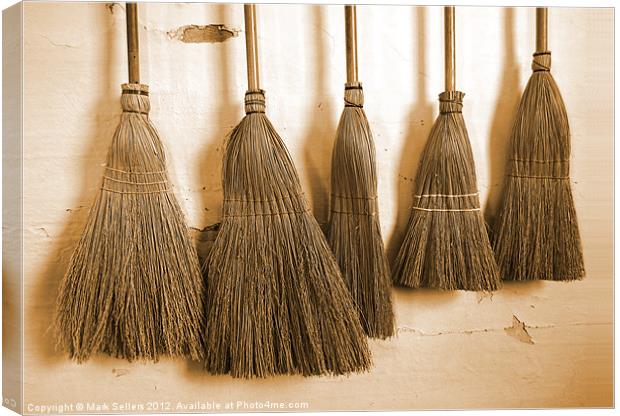 Shaker Brooms on a Wall Canvas Print by Mark Sellers