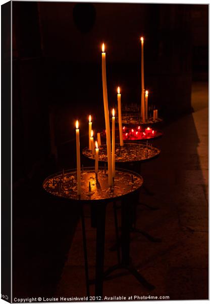 Lit candles in a church Canvas Print by Louise Heusinkveld