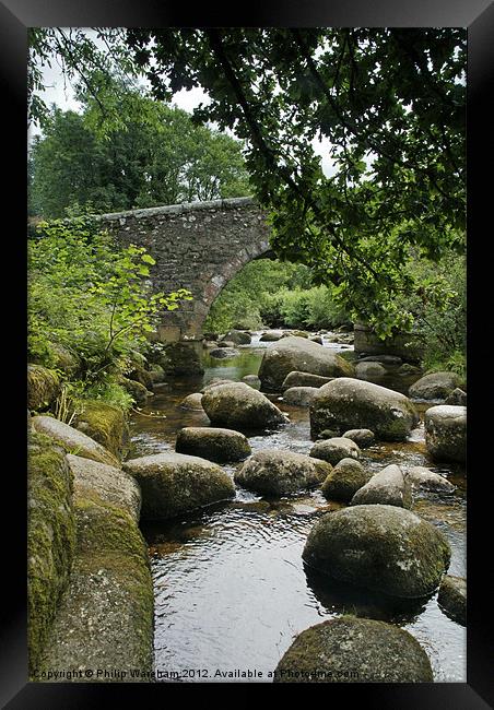 Rocks in the river Framed Print by Phil Wareham