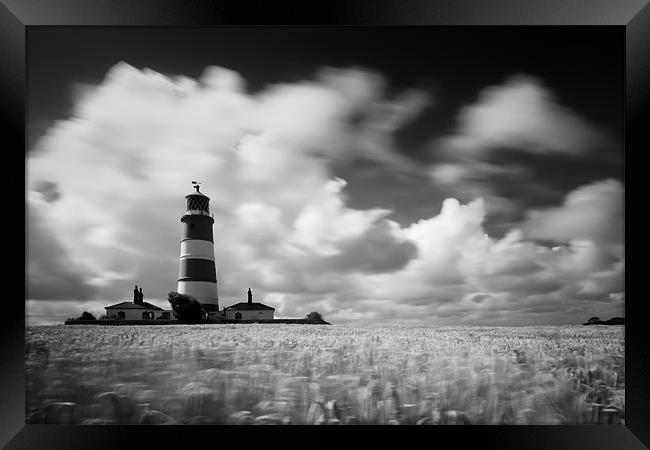 Windswept Happisburgh Lighthouse Framed Print by Simon Wrigglesworth