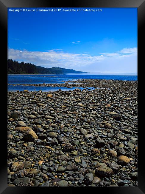 Pebble beach at low tide Framed Print by Louise Heusinkveld