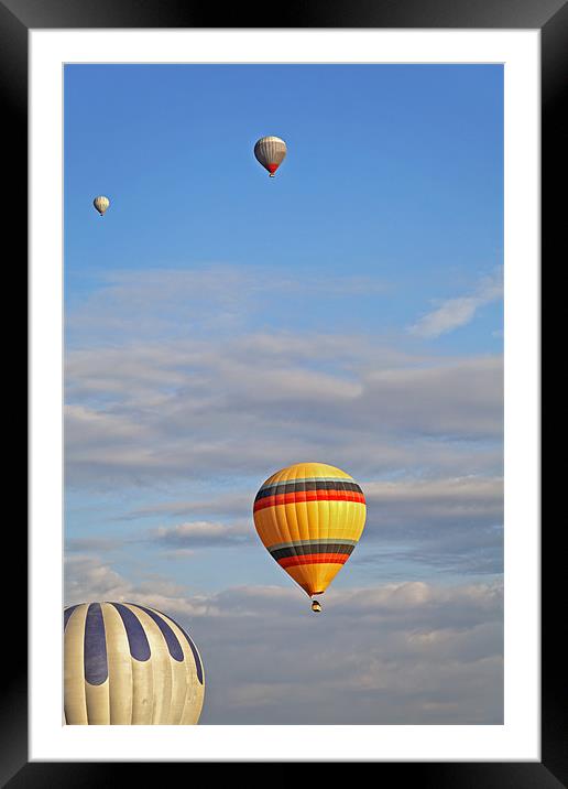 Balloons drifting blue cloudy sky Framed Mounted Print by Arfabita  