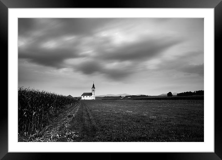 Storm clouds gather over church Framed Mounted Print by Ian Middleton