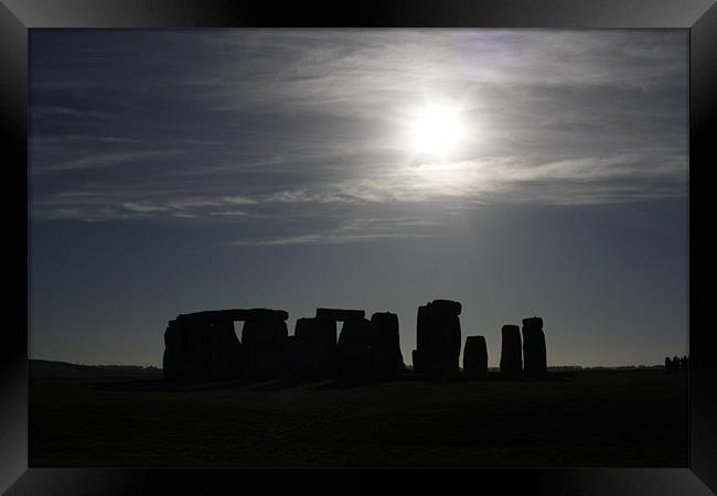 Sun Behind Stonehenge Framed Print by Richie Fitzgerald