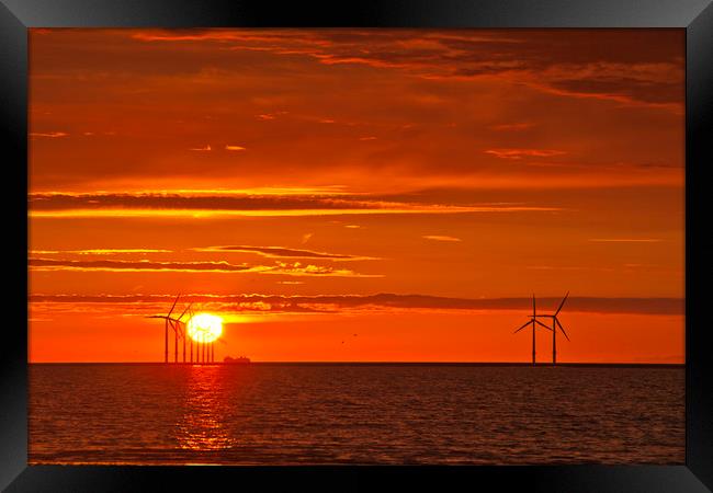 FLAMING RED SKY ( Wind turbines at sea ) Framed Print by raymond mcbride