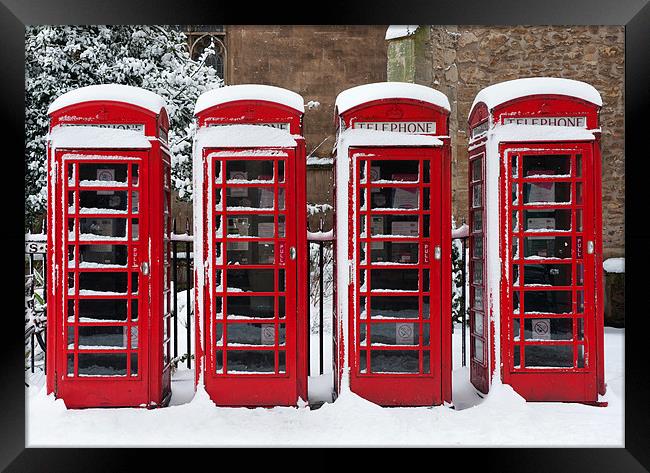 Phone boxes in the snow Framed Print by Stephen  Hewett