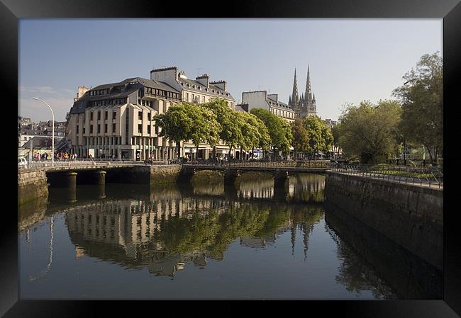 River reflections in a Quimper city scene Framed Print by Simon Armstrong