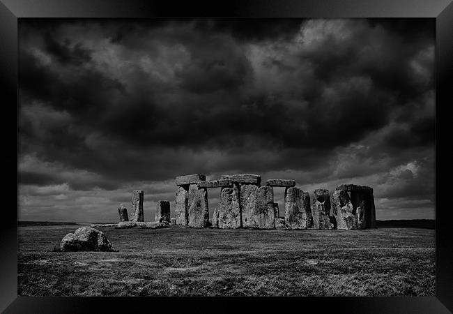 Stonehenge, with dramatic sky Framed Print by Graham Moore