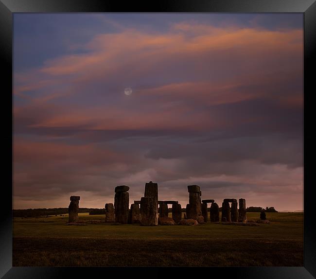 Stonehenge at dusk Framed Print by Graham Moore