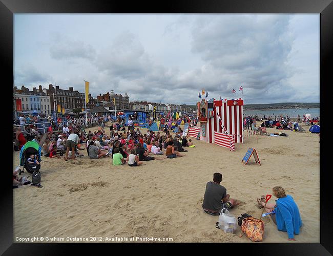 Punch and Judy, Weymouth Beach Framed Print by Graham Custance