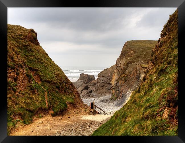Walking down To Sandymouth Beach Framed Print by Mike Gorton