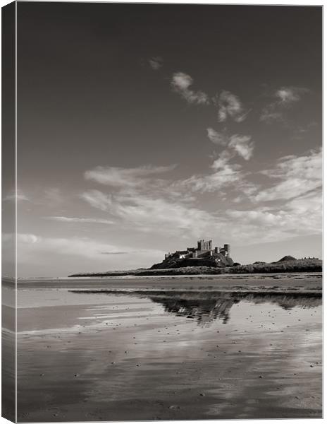 Bamburgh Castle reflections Canvas Print by Graham Moore