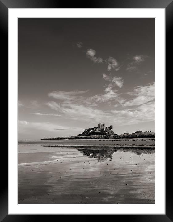 Bamburgh Castle reflections Framed Mounted Print by Graham Moore