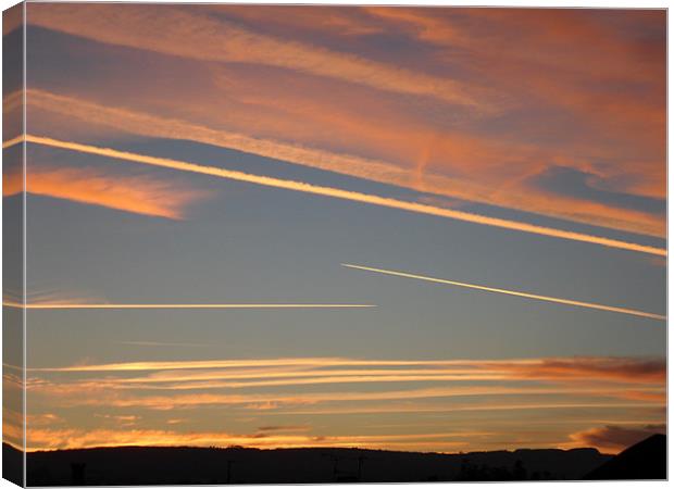 Jet Streams Sunset 2 Canvas Print by Roger Stevens