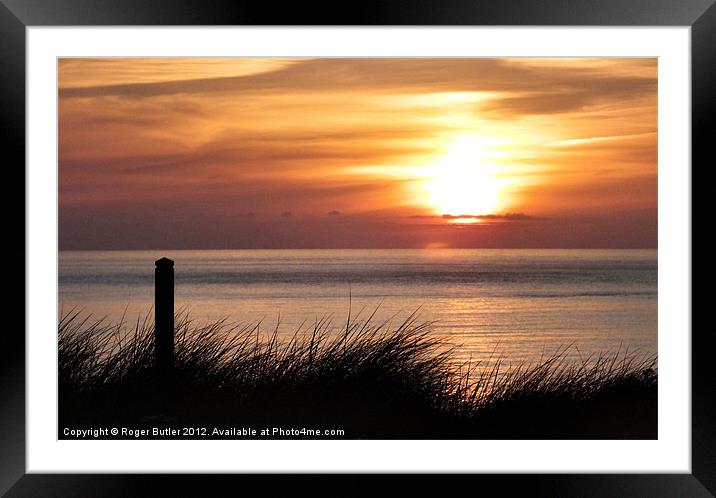 Golden Sun Sinks Westwards Framed Mounted Print by Roger Butler