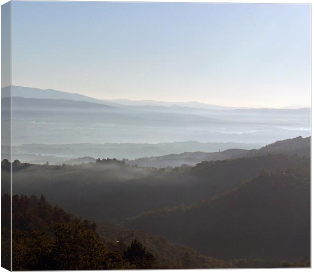 Tuscan Valleys of mist Canvas Print by Richard Ashton