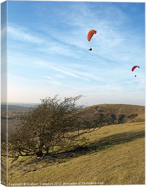 Paragliding on the Downs Canvas Print by Graham Custance