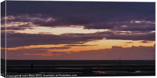 Antony Gormleys Another Place at Sunset Canvas Print by John Wain