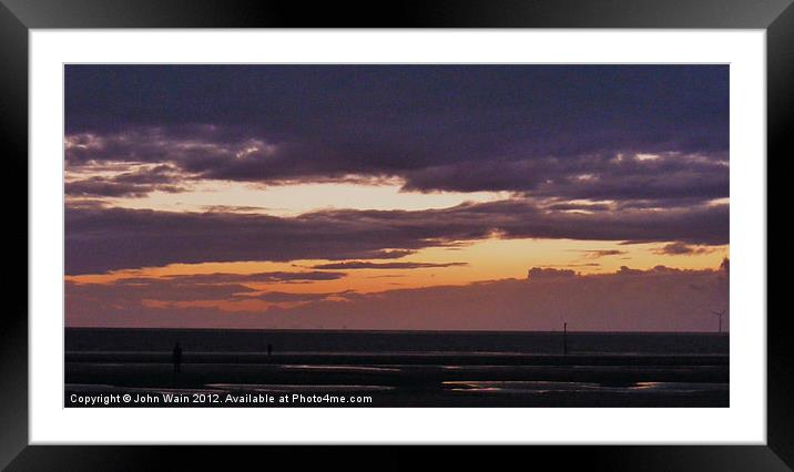 Antony Gormleys Another Place at Sunset Framed Mounted Print by John Wain