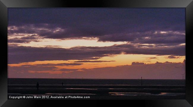 Antony Gormleys Another Place at Sunset Framed Print by John Wain