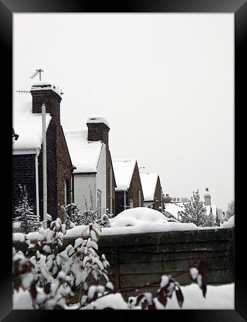 Rooftops in the snow Framed Print by claire beevis