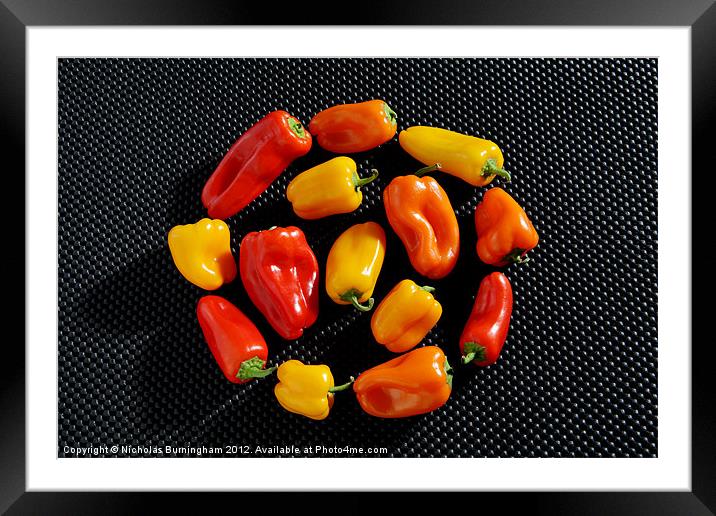 Mixed red, orange and yellow peppers Framed Mounted Print by Nicholas Burningham