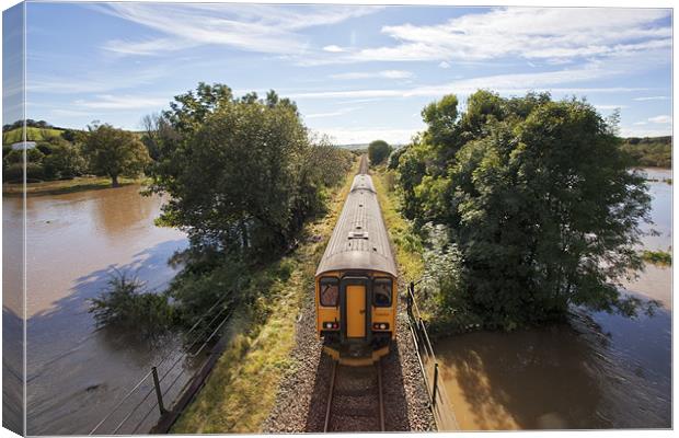 Train Journey Through Flooded Land Canvas Print by Mike Gorton
