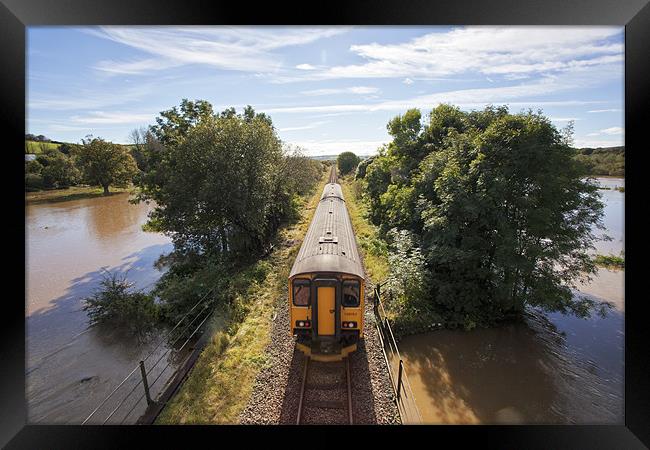 Train Journey Through Flooded Land Framed Print by Mike Gorton