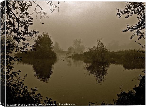 Foggy morning over the lake Canvas Print by Sue Bottomley