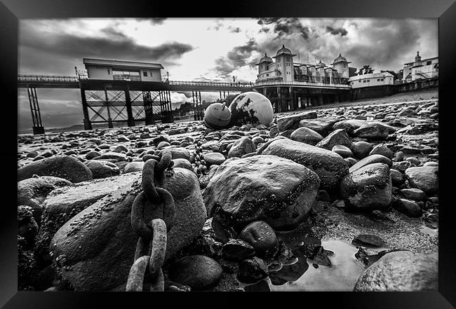 Penarth Pier on the rocks Framed Print by Rob Jones