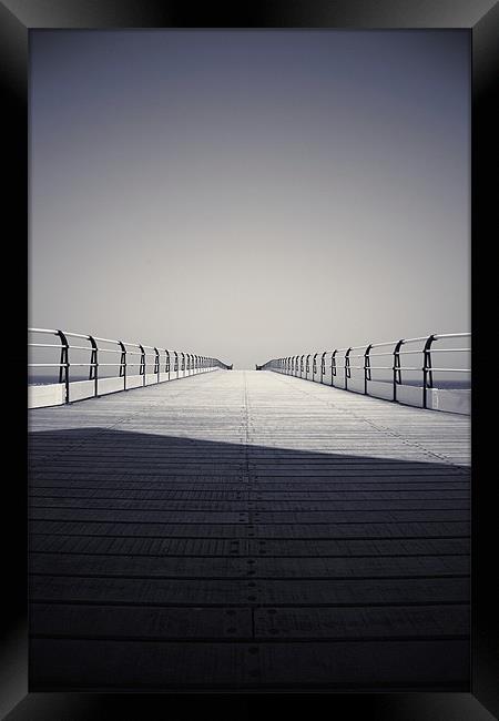 Looking down the pier Framed Print by Phillip Shannon