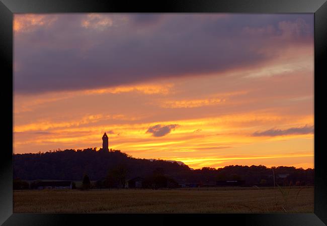 October Sunset behind The Wallace Monument Framed Print by Richard Westwood