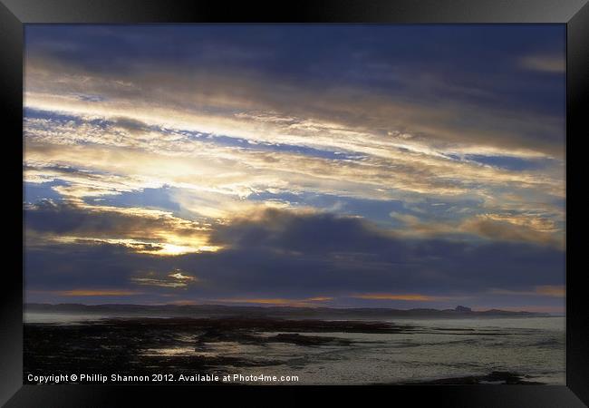 Sun set over coast Framed Print by Phillip Shannon