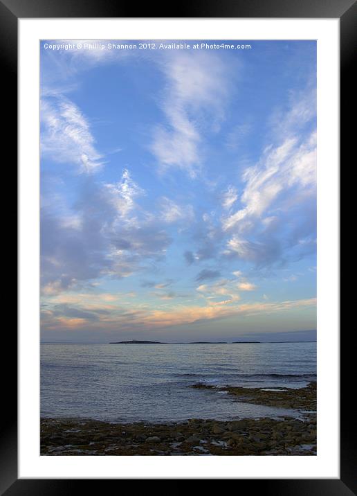 Sun set over coast in Seahouses Framed Mounted Print by Phillip Shannon