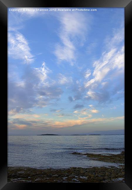 Sun set over coast in Seahouses Framed Print by Phillip Shannon
