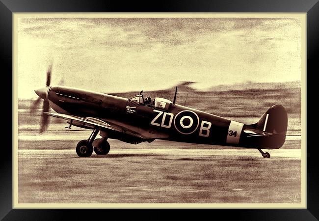 Spitfire Landing Framed Print by Chris Lord