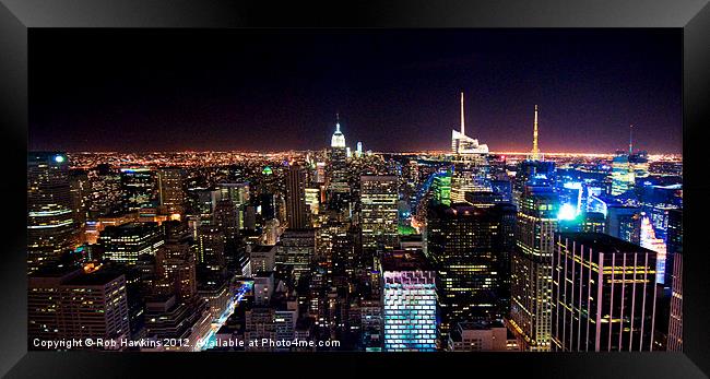 Manhattan Skyline by night Framed Print by Rob Hawkins