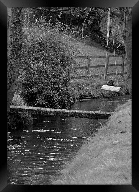 Swing Over Water Framed Print by Andy Freeman