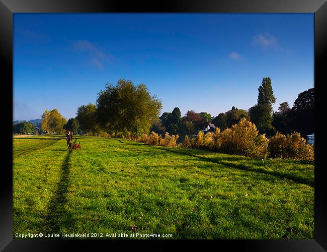 Man walking two dogs at Cookham, Berkshire Framed Print by Louise Heusinkveld