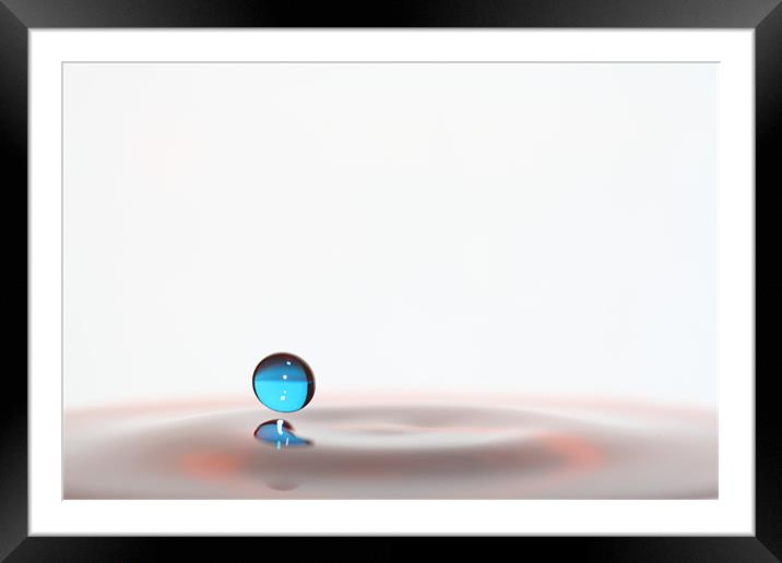 Hovering Sphere of Blue Framed Mounted Print by Mark Kendrick