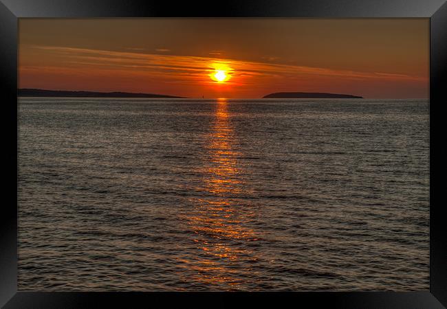Puffin Island Sunset Framed Print by David Craig Hughes