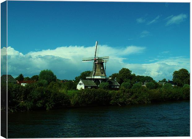 Dutch windmill on windy day Canvas Print by Malcolm Snook