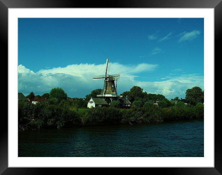 Dutch windmill on windy day Framed Mounted Print by Malcolm Snook