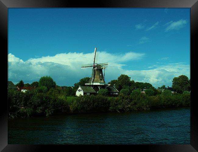 Dutch windmill on windy day Framed Print by Malcolm Snook