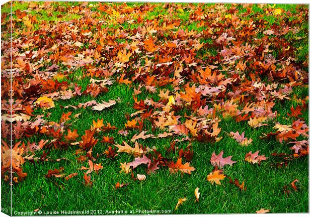 Oak leaves on the grass in autumn Canvas Print by Louise Heusinkveld